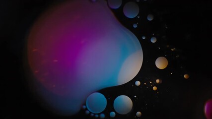 Organic, liquid-like cinematic lens flares slowly merging and separating, creating a fluid and evolving seamlessly looping video texture website, branding, calming