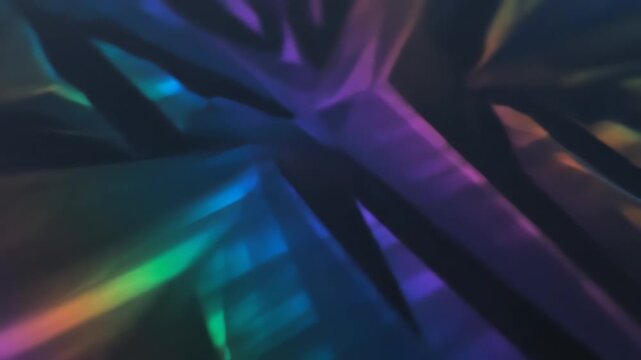 Prismatic holographic refractions creating sharp, angular light patterns in a seamlessly looping video, ideal for tech themes presentation, visuals, technology