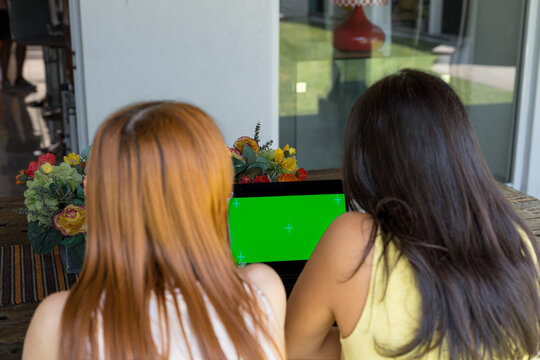 Teammates view data on a large monitor