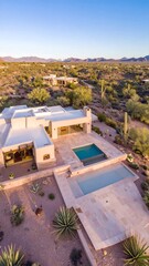 Desert home with pool and patio, aerial view