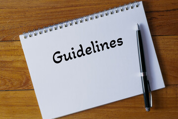 Guidelines written in a notebook on wooden desk