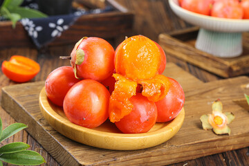 Fresh Ripe Persimmons on Wooden Plate - Traditional Asian Fruit Display