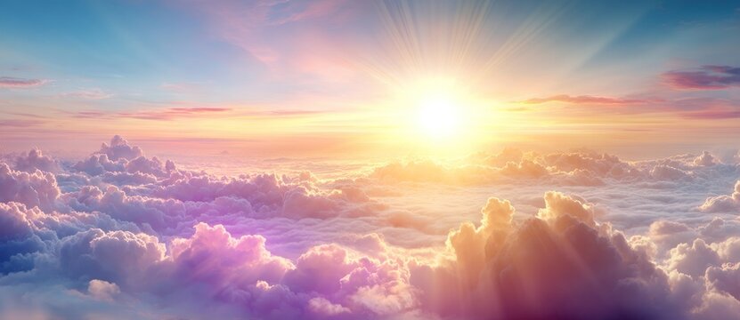 A sunburst shines above an endless sea of fluffy, pink-tinged clouds against a gradient sky of blue and orange hues, dreamy and ethereal