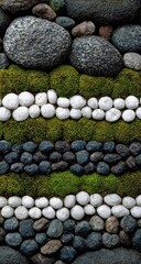 Abstract textured wall of layered natural stones and vibrant green moss.