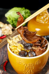 Buddha Jumps Over the Wall Chinese Soup with Mushrooms and Bamboo Shoots in Traditional Ceramic Bowl
