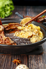 Chinese Hot Pot with Mushrooms and Vegetables in Traditional Clay Pot