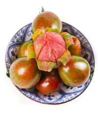 Striped Heirloom Tomatoes in Ceramic Bowl - Fresh Organic Vegetables with Camouflage Pattern on White Background