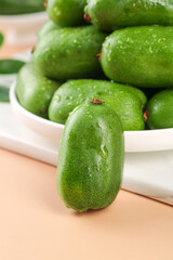 Fresh Green Cucumbers with Water Droplets in White Bowl on Wooden Surface - Healthy Organic Vegetables