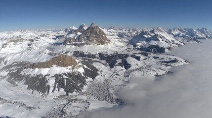Snowy Alpine peaks, valleys, and clouds