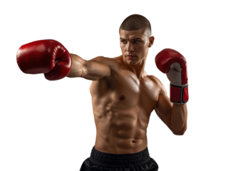 Intense shirtless boxer throwing a powerful punch with red boxing gloves on an isolated background