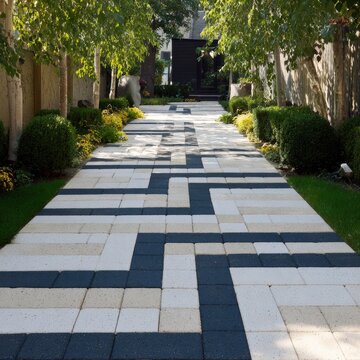 Modern geometric garden pathway with interlocking pavers and manicured landscaping.