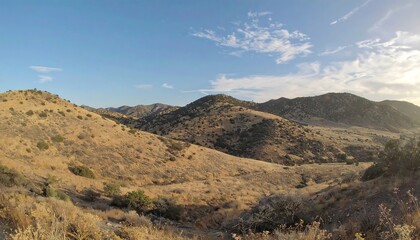 Desert mountain vista under a pale blue sky