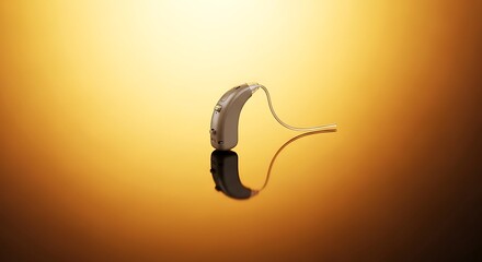 Discreet behind-the-ear hearing aid against a shimmering golden backdrop