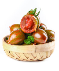 Fresh Ripe Tomatoes with Sage Herbs in Bamboo Basket Still Life