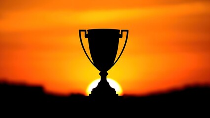 Abstract trophy silhouette against a vibrant sunset, symbolizing achievement and victory.