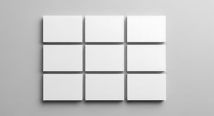 Arrangement of nine white rectangular cards on gray background