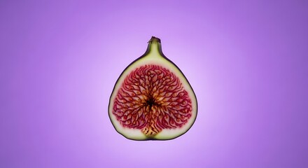 Elegant cross-section of fresh fig fruit on violet color studio backdrop