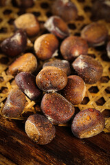 Raw Chestnuts with Water Droplets in Wicker Basket - Fresh Alpine Autumn Harvest