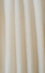 Obraz premium Soft, flowing cream linen fabric drapes elegantly, creating a serene, luxurious backdrop for interior design or fashion concepts