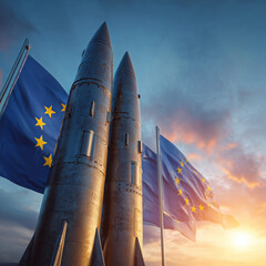 Nuclear missiles on background of France and European Union flags against the sunset. Concept of nuclear defense of the European continent by France 