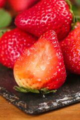 Fresh Organic Strawberries Cut in Half on Slate Board - Healthy Red Berry Fruit