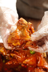 Gourmet Marinated Pork Trotters in Hands - Traditional Asian Delicacy Food