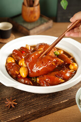 Gourmet braised pork trotters with peanuts in savory sauce - traditional Asian cuisine