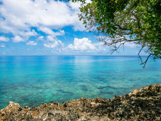 San Andres island, Colombia, 08.22.2025: view of the rocky coast with crystalline water.