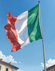 Italian flag waving in a clear blue sky