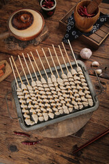 Shaanxi Gluten Kebab Skewers Traditional Chinese Street Food Specialty with Spices and Clay Pot