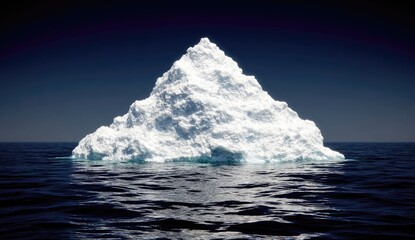 Massive iceberg floats on dark ocean