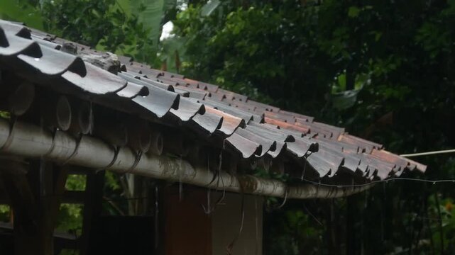 raindrops from the roof of a traditional house