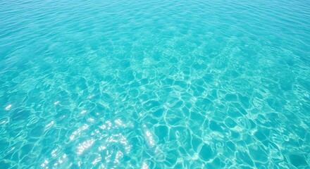 Obraz premium Serene background of crystal clear turquoise sea water with shimmering sunlight caustics