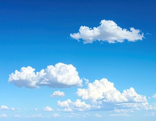 Fluffy white cumulus clouds drift across a vibrant blue sky, creating a serene and airy atmospheric perspective