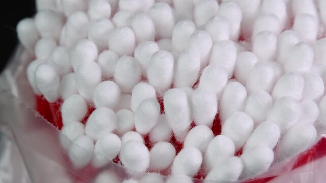 Cotton swabs rotating, cotton buds close up shot. Personal hygiene and cosmetic items. Ear cleaning q-tips