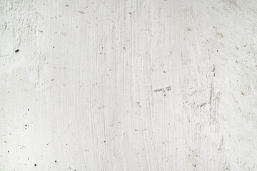 Textured white surface, possibly painted wall. Suitable for backgrounds, design elements, or texture overlays in graphic projects or presentations.