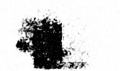 Abstract digital art, a dark central spot surrounded by a scattering of tiny colored dots