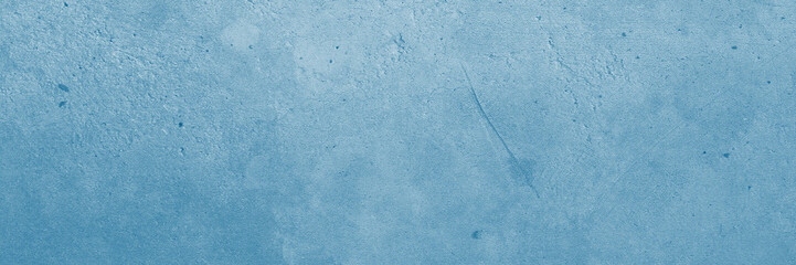 Light blue concrete wall texture close up. Suitable for backgrounds, texture design projects, and graphic design applications.