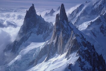 Sharp, jagged mountain peaks pierce swirling clouds and snow-covered slopes, creating a majestic and serene winter landscape scene