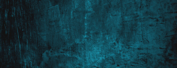 Turquoise wall with dark cracks, suitable for backgrounds, textures, and abstract designs in web or print projects.