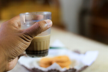 Breakfast and snack menu. Butter biscuits with pineapple jam and a glass of chocolate milk. Close-up of butter cookies and a glass of chocolate, sweet cakes. Perfect for recipes, articles, catalogs.