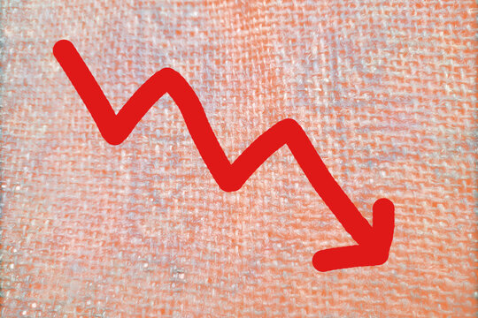 Business downfall and industry decline with sales dropping trend, red down arrow on light orange background
