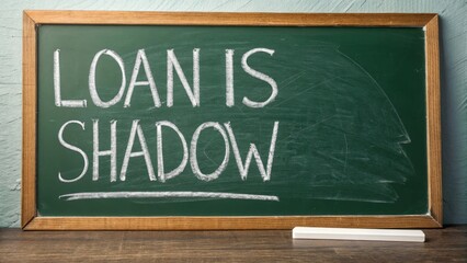 Conceptual chalkboard message emphasizing the idea of loans and their potential hidden consequences in a business context