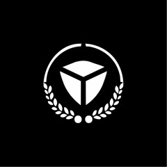 A stylized white emblem featuring a three-dimensional geometric shape within a laurel wreath, set against a stark black background.