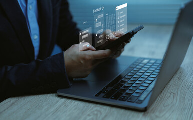 Businessman using smartphone and laptop chatbot digital interface concepts online support customer communication service data management technology virtual business connection