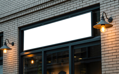 Blank white signboard above storefront entrance brick building exterior illuminated by lamps illustration