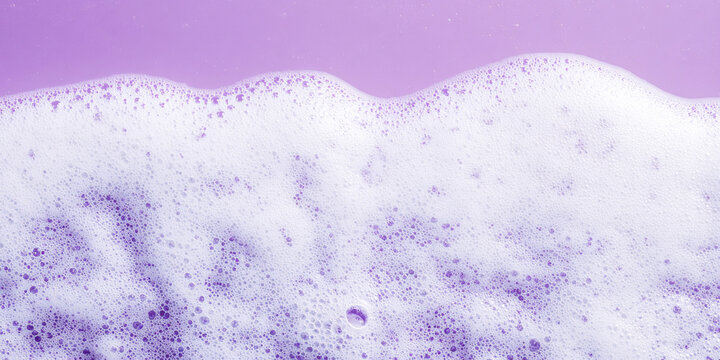 close-up, lush white detergent foam, abstract purple background, copy space,washing foam, horizontal banner for a cleaning company or laundry, poster, top view, free space for text