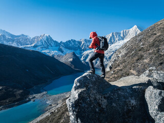 Fototapeta premium Successful woman hiker on high altitude mountain top