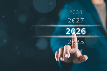 Businessman touching on number 2026 for preparation and change to merry Christmas and happy new year.