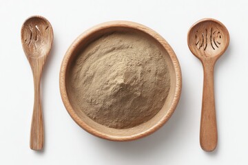 Wooden bowl with light brown powder and wooden spoons